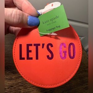 kate spade Round Leather Luggage Tag in Vibrant Orange